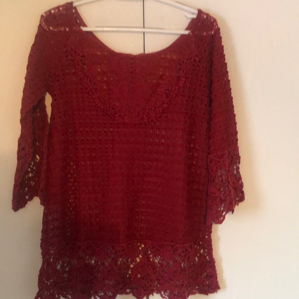 Woman’s burgundy spring eyelet lace blouse top